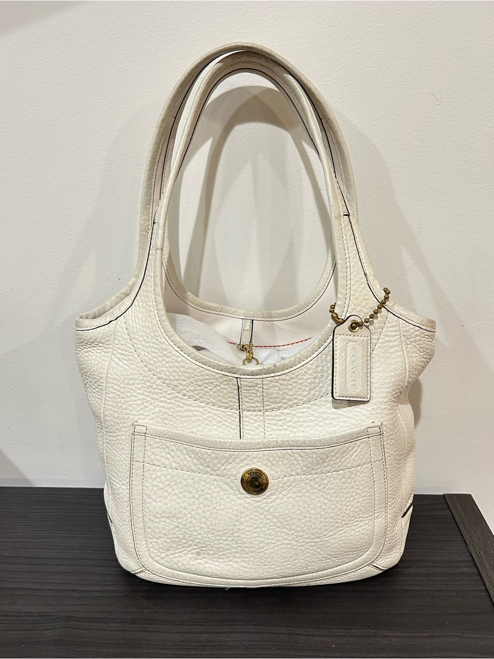 Coach Ergo Legacy shoulder bag crafted from pebbled leather. GUC